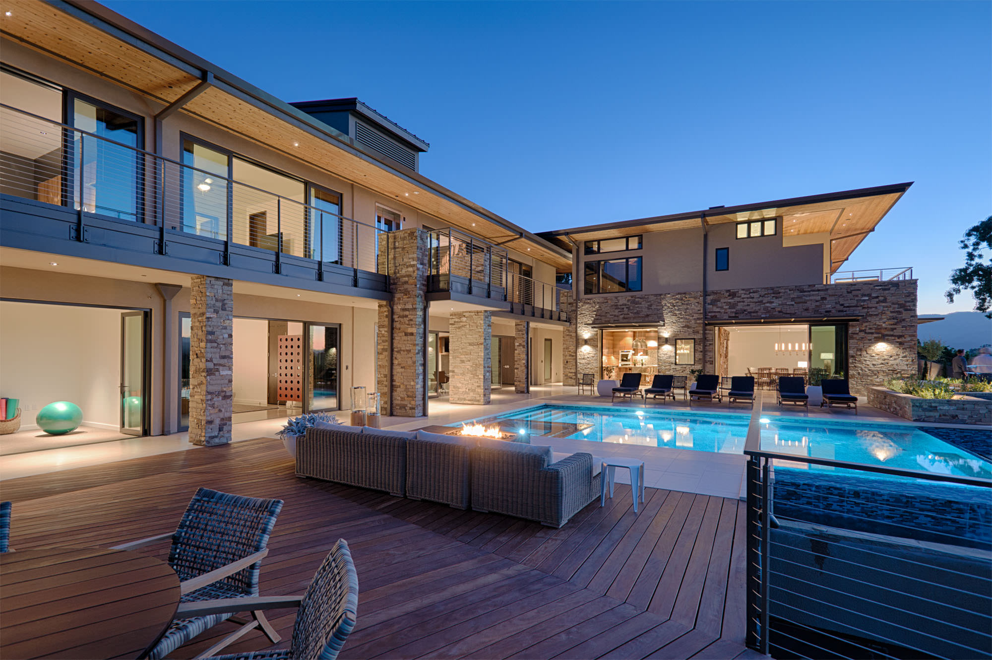 Custom seating area alongside pool area at Oakville hillside residence