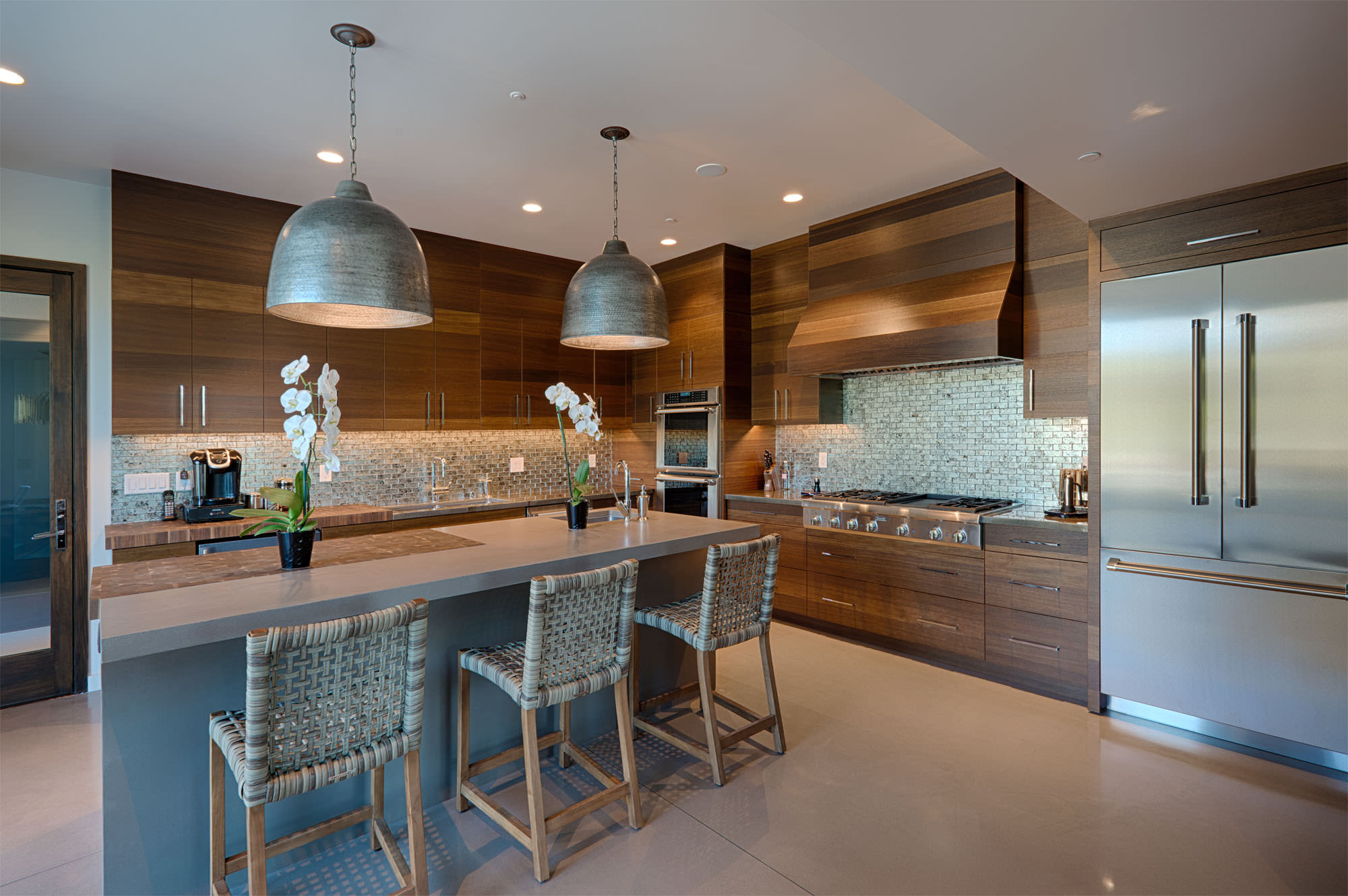 Modern kitchen with wood cabinets at Oakville hillside residence