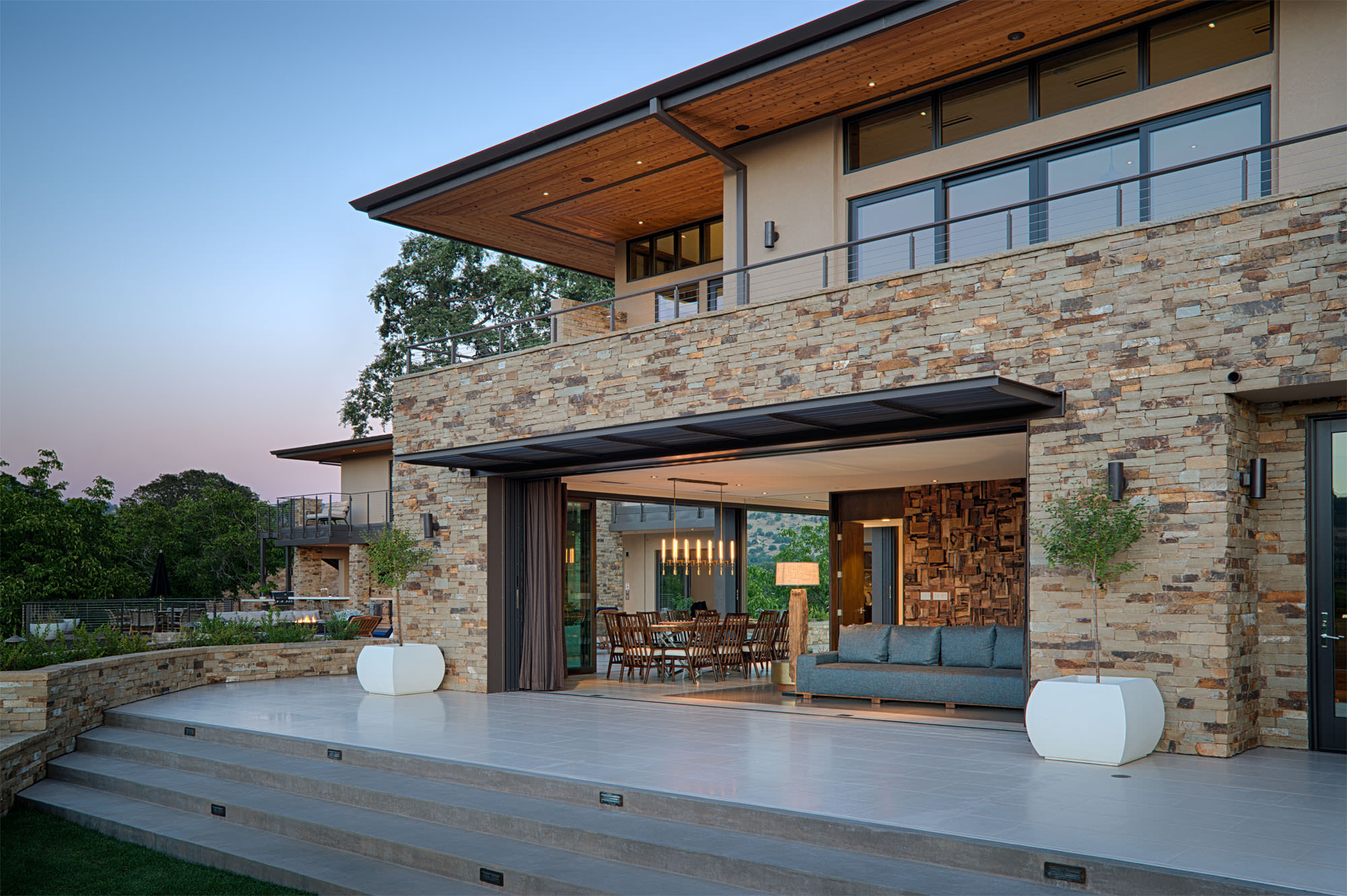 Rock facing on exterior of home at Oakville hillside residence