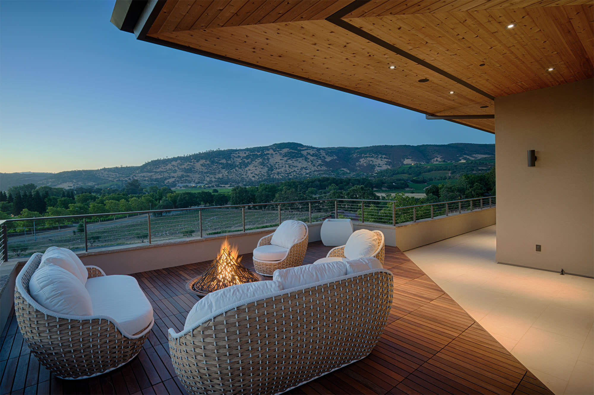 Patio overlooking vineyards at Oakville hillside residence