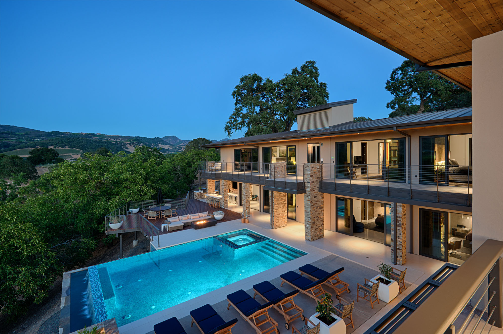 Infinity pool and deck overlooking vineyards at Oakville hillside residence