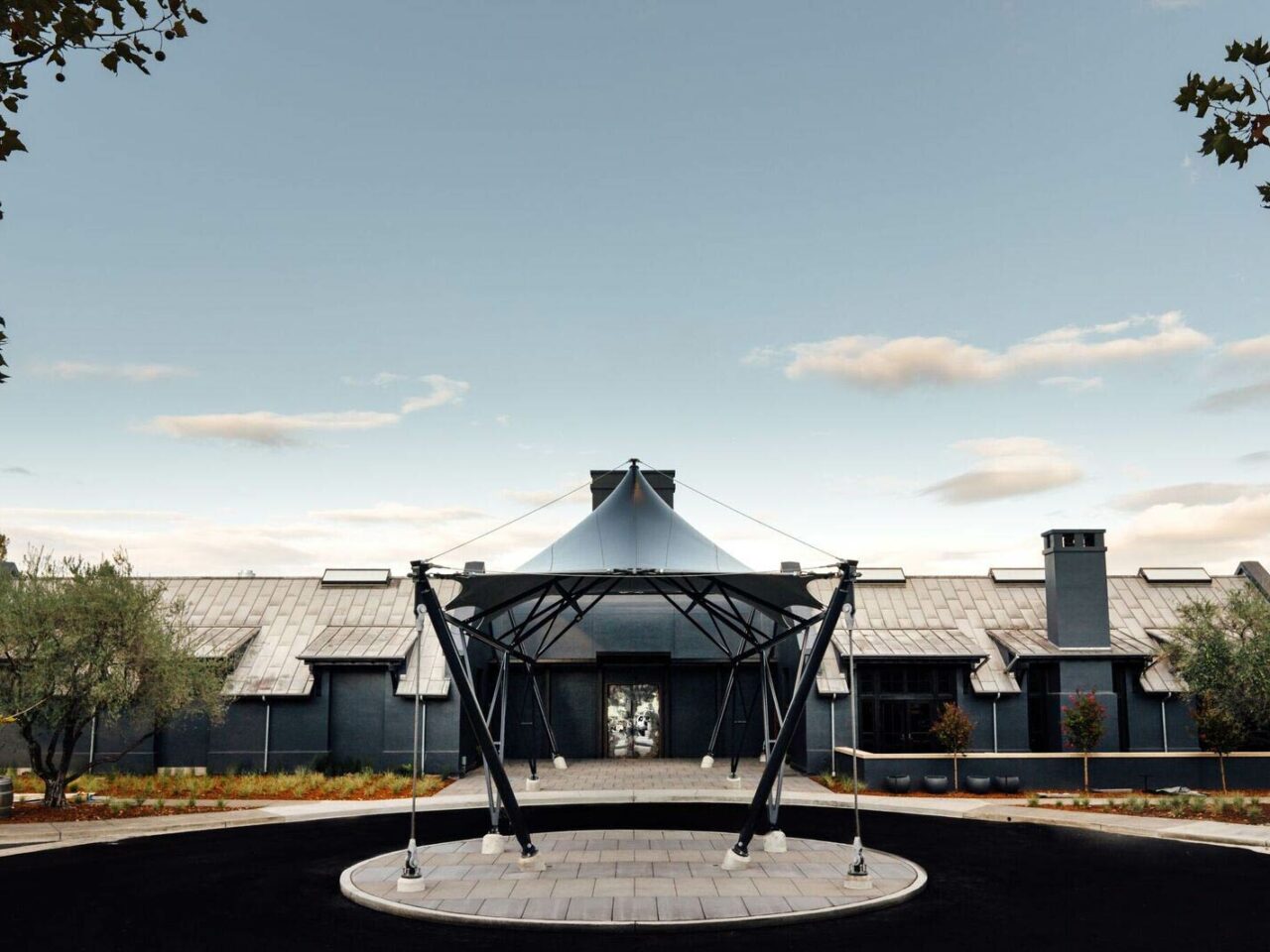 Entrance of Prisoner Wine Co. in Napa with partly cloudy skies