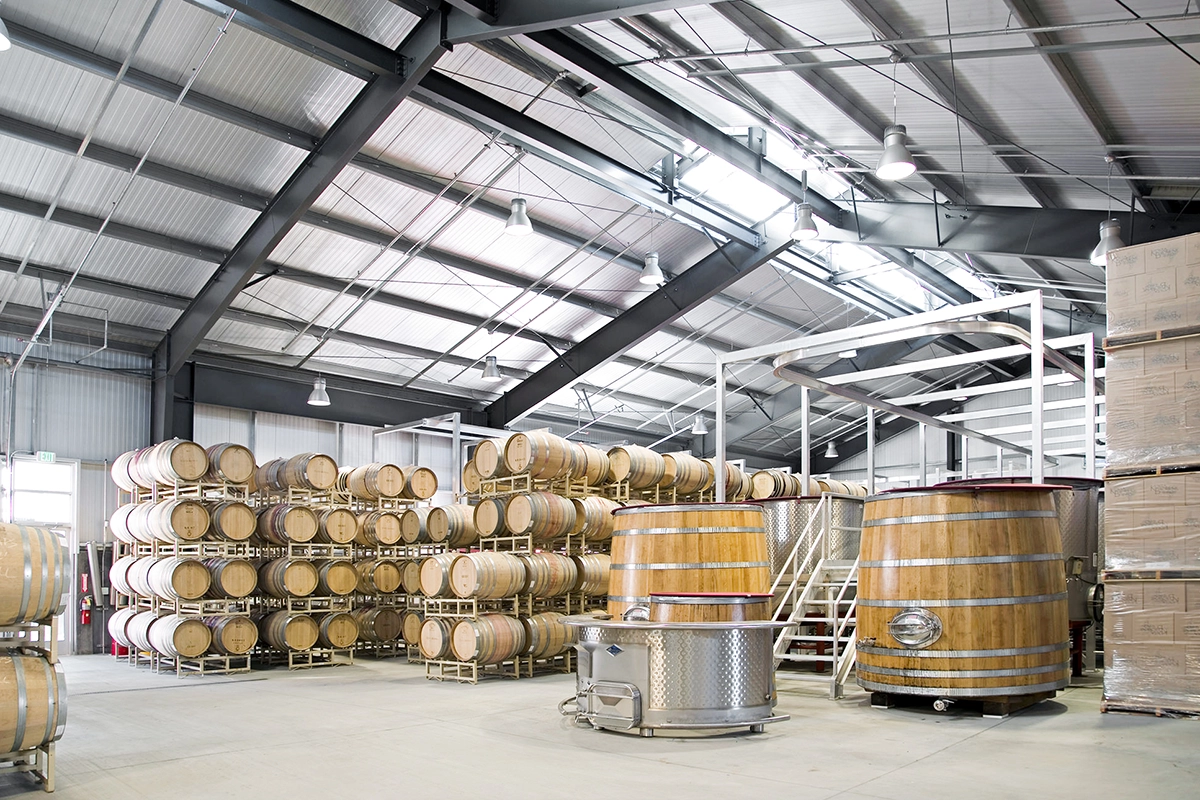 The interior of the barrel storage building at Kosta Browne Winery in Sebastopol